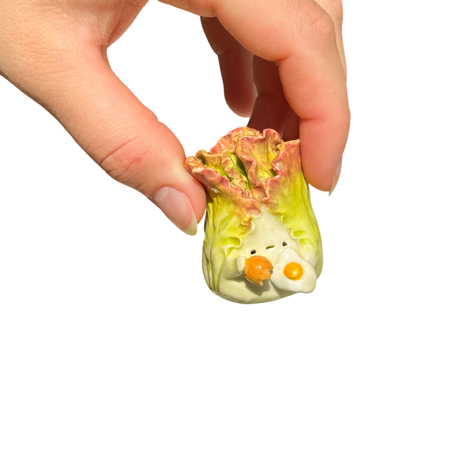 Lettuce with cracked egg